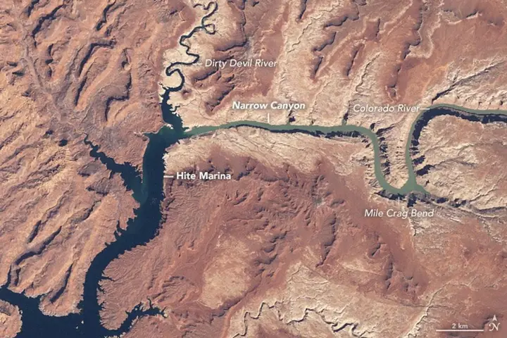 Satellite image of Lake Powell as a broad dark blue lake filling the canyons near Hite Marina.